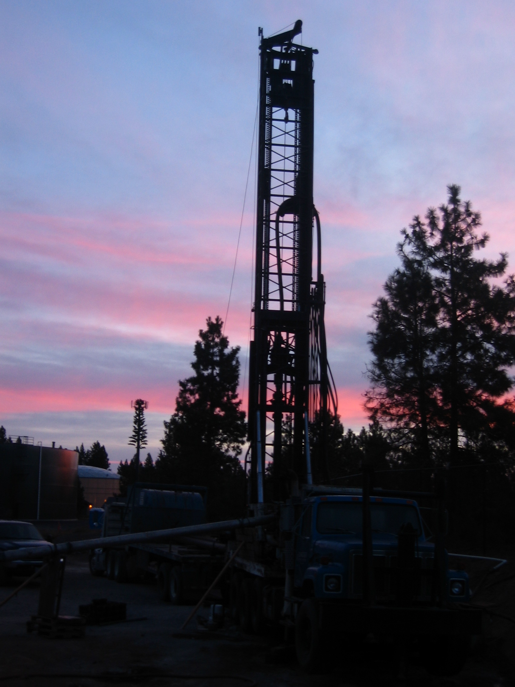 Water Services Drilling with a sunset in the background